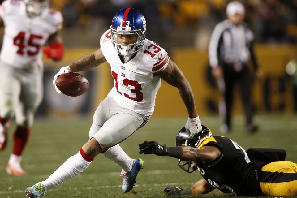 FILE - In this Sunday, Dec. 4, 2016 file photo, New York Giants wide receiver Odell Beckham (13) runs after a catch during the second half of an NFL football game against the Pittsburgh Steelers in Pittsburgh. A playoff berth is within a lengthy reach for the Giants. They must win and have Washington lose, Minnesota and Green Bay both lose or tie. They still can grab the NFC East if they stay hot and Dallas clumps. (AP Photo/Jared Wickerham, File)
