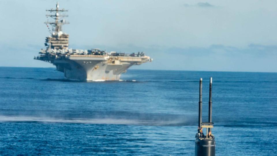 The U.S. Navy submarine Annapolis and aircraft carrier Ronald Reagan participate in an antisubmarine exercise with South Korea and Japan in waters between the two countries on Sept. 30, 2022. (South Korean Defense Ministry via Getty Images)