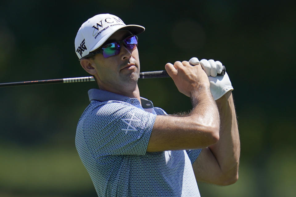 Cameron Tringale watches his shot on the third tee during the first round of the BMW Championship golf tournament at Wilmington Country Club, Thursday, Aug. 18, 2022, in Wilmington, Del. (AP Photo/Julio Cortez)