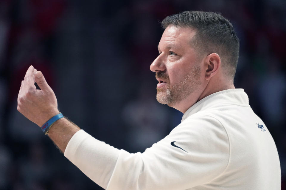 Mississippi head coach Chris Beard motions for his team to gather during the second half of an NCAA college basketball game against Mississippi State, Tuesday, Jan. 30, 2024, in Oxford, Miss. (AP Photo/Rogelio V. Solis)