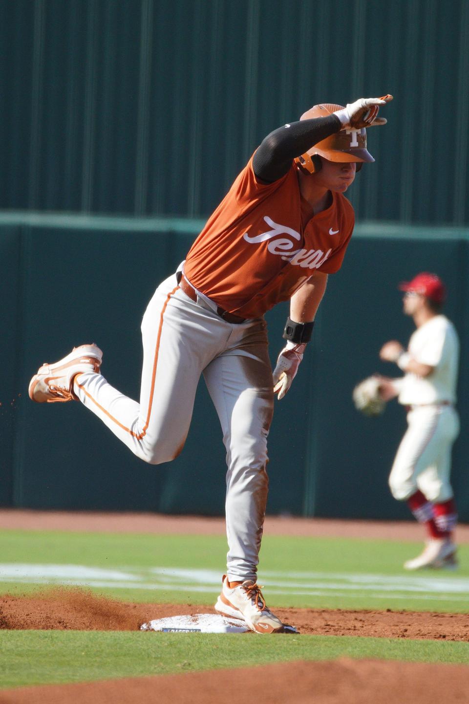 Texas' Kimble Schuessler celebrates a double during Friday's 12-5 victory over Louisiana in the teams' College Station Regional opener.