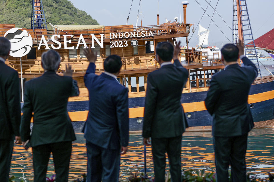 From left to right, Singapore's Prime Minister Lee Hsien Loong, Thailand's Deputy Prime Minister and also Foreign Minister Don Pramudwinai, Vietnam's Prime Minister Pham Minh Chinh, Indonesian President Joko Widodo and Laotian Prime Minister Sonexay Siphandone wave during the 42nd ASEAN Summit in Labuan Bajo, East Nusa Tenggara, Indonesia, Wednesday, May 10, 2023. (Bay Ismoyo/Pool Photo via AP)