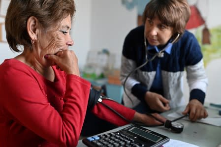 The Wider Image: Russian village's last teacher stays on for her one remaining pupil