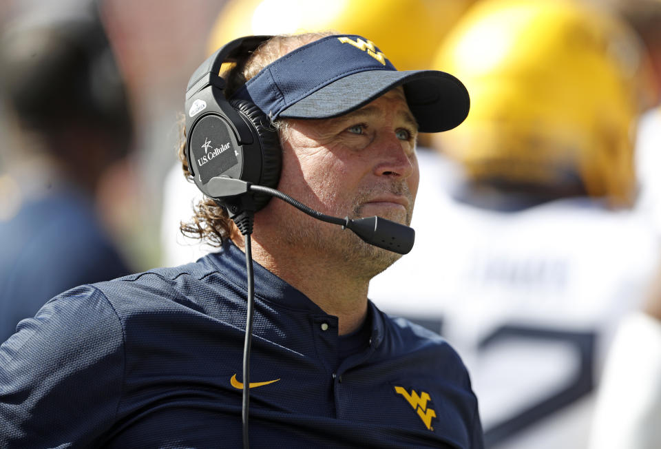 West Virginia’s Dana Holgorsen would be returning to a more natural tie to his roots if he took the Buffaloes job. (AP)