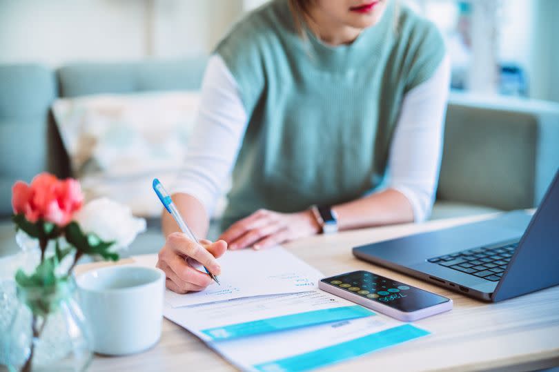 Young woman managing her home finances