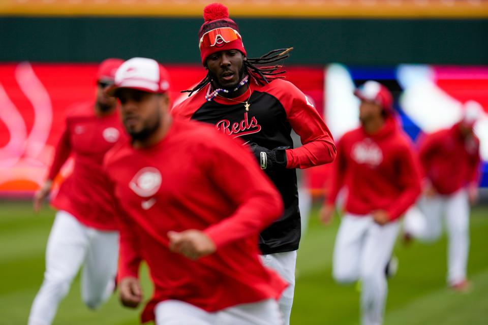 Reds shortstop Elly De La Cruz (top) runs a drill during the final preseason workout ahead of Opening Day at Great American Ball Park Wednesday. De La Cruz won't be working with his expected double-play partner Matt McLain, who had shoulder surgery Tuesday.  “We’ll miss him a lot,” De La Cruz said.
