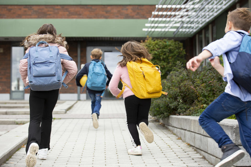 kids running into school