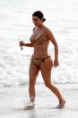 <p>Wearing a vintage Dior bikini.<br><i>[Photo: FameFlynet]</i> </p>