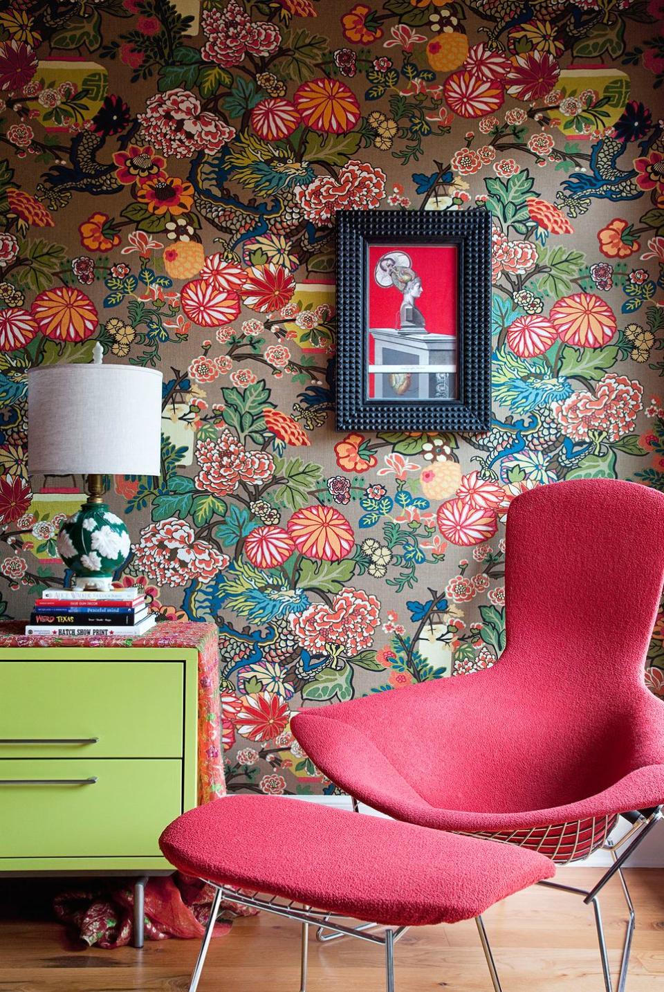 <p>If you don't have room for a whole library, you can create a one-of-a-kind reading space complete with vibrant wallpaper and colorful furniture.</p>
