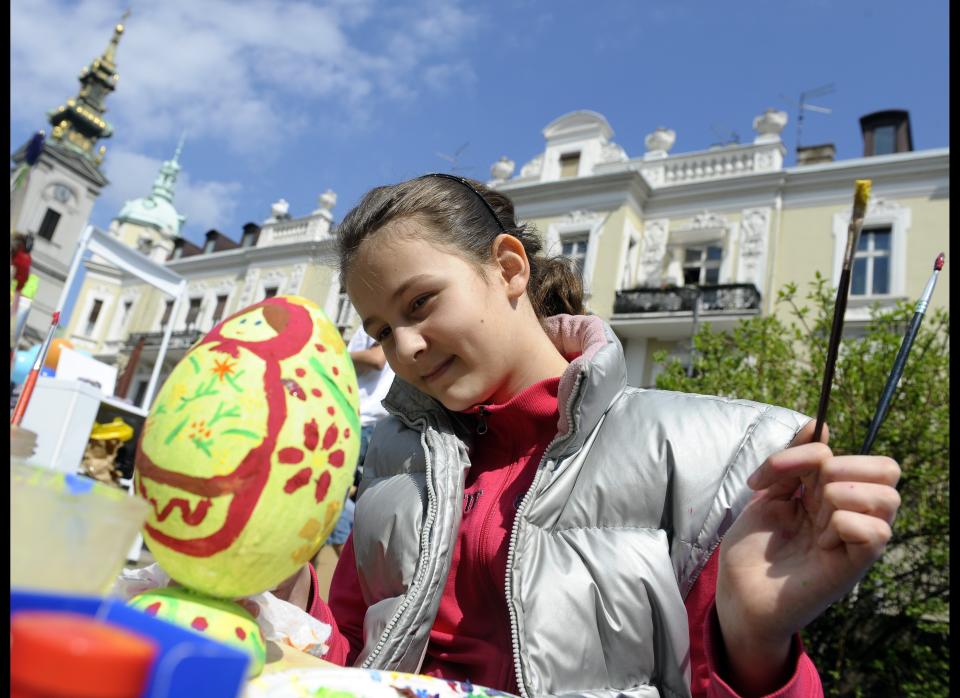 A girl finishes a hand decorated Easter egg on April 1, 2010, in Belgrade. Traditionally Orthodox Serbs observe Easter according to the old Julian calendar, which this year falls also on April 4.  AFP PHOTO / Andrej ISAKOVIC