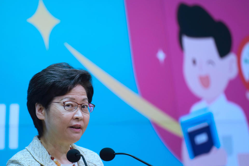 Hong Kong Chief Executive Carrie Lam attends a press conference in Hong Kong, Tuesday, July 13, 2021. Lam said that authorities will press on with the oath-taking requirement for district councilors to pledge allegiance to Hong Kong, despite an exodus over the last week. (AP Photo/Vincent Yu)