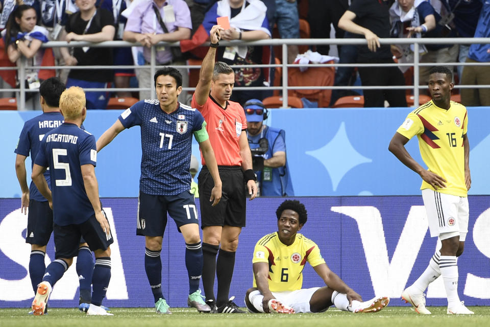 Carlos Sanchez is shown a red card during Colombia’s Group Stage clash with Japan. (Getty)