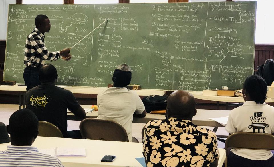 During a class at North Parish Congregational Church in downtown Sanford, Maine, Abel Nimi teaches English to his fellow asylum seekers from Angola on Friday, Sept. 8, 2023.