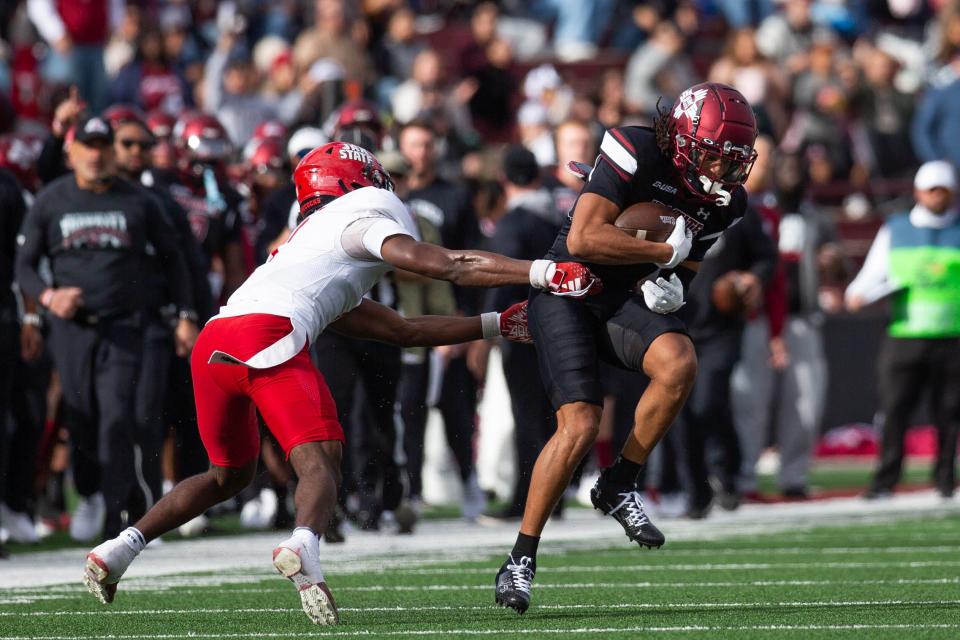 NMSU wide receiver Chris Bellamy runs the ball during a NMSU football game on Wednesday, May 22, 2023, at the Aggie Memorial Stadium.