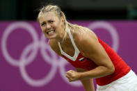 LONDON, ENGLAND - JULY 31: Maria Sharapova of Russia react after a shot against Laura Robson of Great Britain during the second round of Women's Singles Tennis on Day 4 of the London 2012 Olympic Games at Wimbledon on July 31, 2012 in London, England. (Photo by Clive Brunskill/Getty Images)