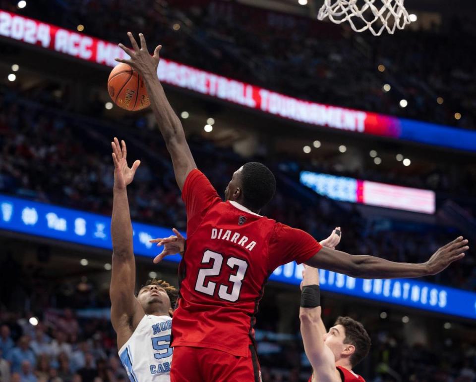 N.C. State’s Mohamed Diarra (23) blocks a shot by North Carolina’s Harrison Ingram (55) in the second half during the ACC Men’s Basketball Tournament Championship at Capitol One Arena on Saturday, March 16, 2024 in Washington, D.C. Diarra had three blocked shots in the Wolfpack victory. Robert Willett/rwillett@newsobserver.com