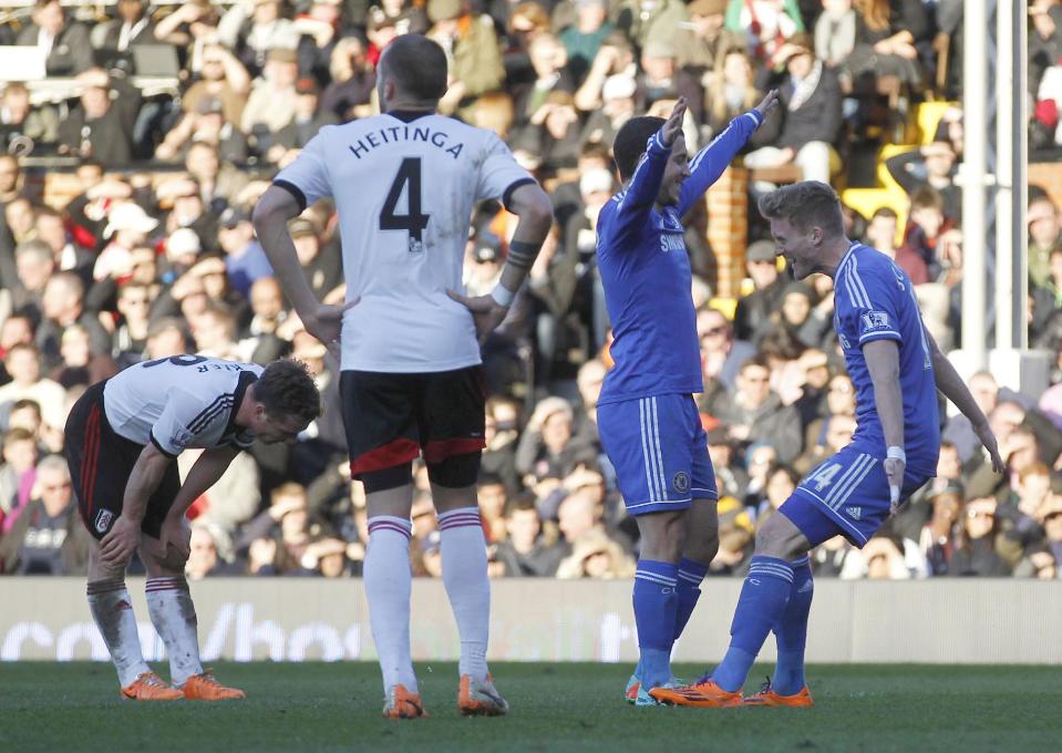 Chelsea's Andre Schurrle, right, celebrates his goal against Fulham with teammate Eden Hazard, second right, during their English Premier League soccer match at Craven Cottage, London, Saturday, March 1, 2014. (AP Photo/Sang Tan)