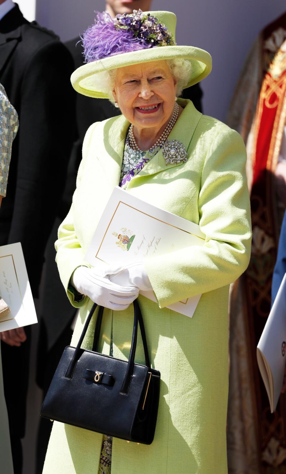 Queen Elizabeth II smiles after the wedding of Prince Harry and Meghan Markle at St George's Chapel at Windsor Castle on May 19, 2018 in Windsor, England