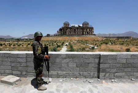 An Afghan National Army (ANA) soldier stands guard after the inauguration of the reconstruction project to restore the ruins of historic Darul Aman palace, in Kabul, Afghanistan May 30, 2016. REUTERS/Omar Sobhani