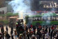 NEW DELHI, Jan. 26, 2021 -- Farmers clash with police in New Delhi, India, Jan. 26, 2021. One person was killed as protesting farmers Tuesday marched in huge numbers and drove their tractors inside the Indian capital city to stage protests against the three farm laws, officials said. On Tuesday thousands of farmers forced their way into the capital city, breaking barricades, triggering police action. (Photo by Str/Xinhua via Getty) (Xinhua/Stringer via Getty Images)