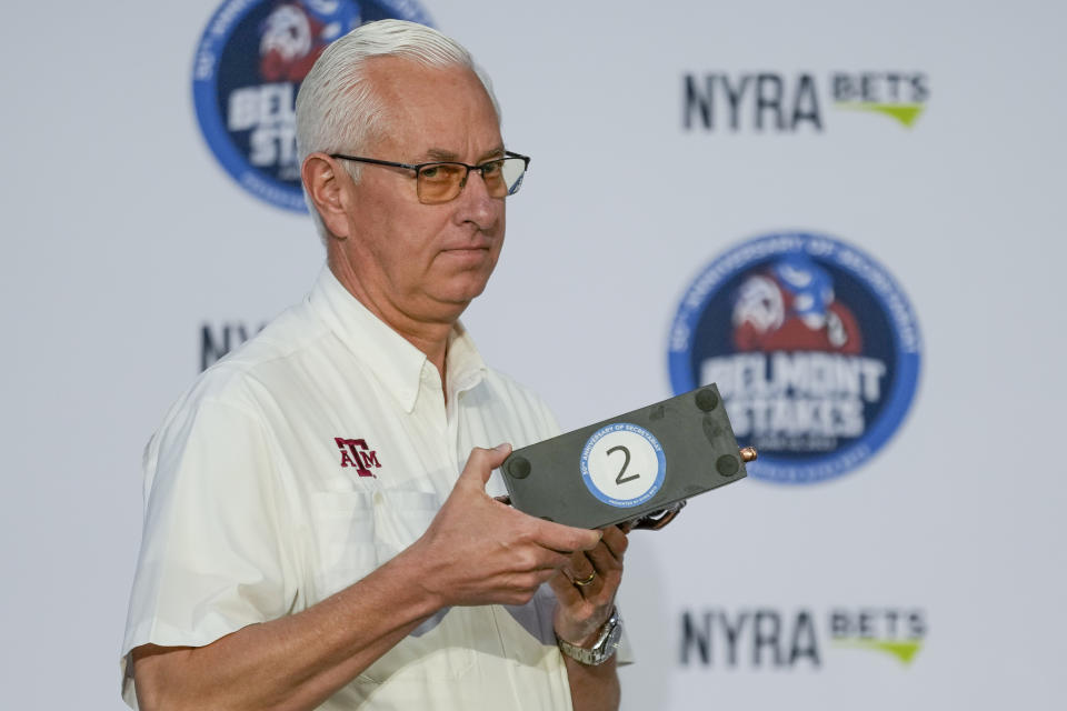 Trainer Todd Pletcher randomly selects second position for his entrant Tapit Trice during a drawing for post positions ahead of the Belmont Stakes horse race, Tuesday, June 6, 2023, at Belmont Park in Elmont, N.Y. (AP Photo/John Minchillo)