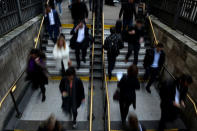 City workers make their way home in the City of London, Britain October 18, 2017. October 18, 2017. REUTERS/Mary Turner