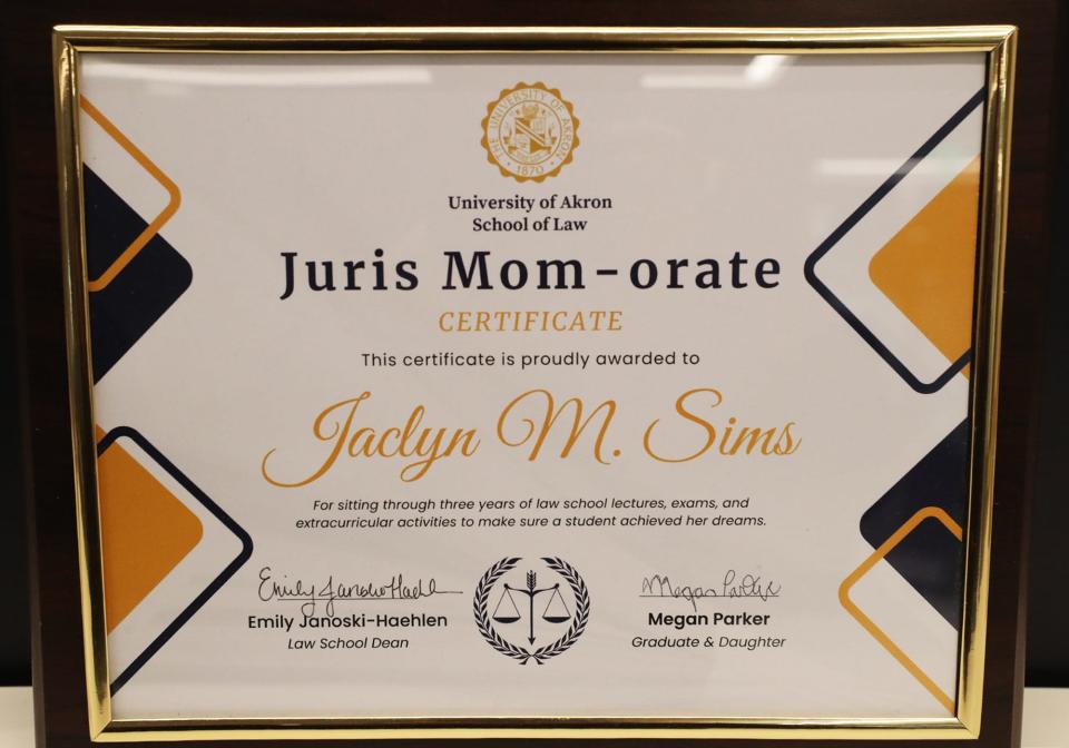 The "Juris Mom-orate" certificate that Megan Parker gave her mother, Jaclyn Sims, to thank her for attending law school classes with her at the University of Akron.