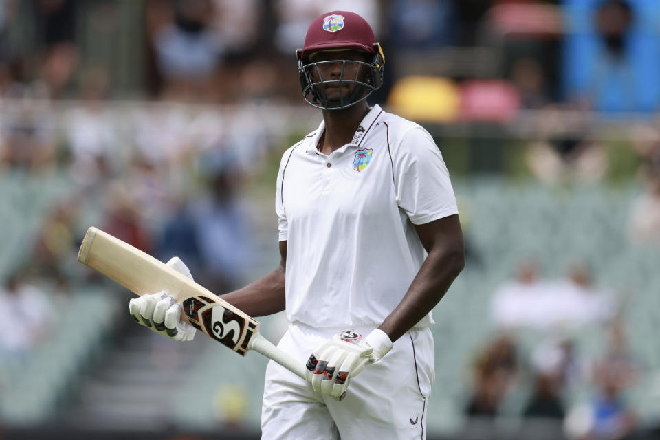 The West Indies' Jason Holder walks off after he is clean bowled by Australia's Mitchell Starc on the fourth day of their cricket test match in Adelaide, Sunday, Nov. 11, 2022. (AP Photo/James Elsby)