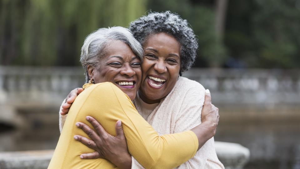 Make friends after 50, two friends hugging