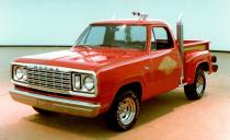 <p>Back in the ’70s, this red pickup with its wild 18-wheeler exhaust stacks was one of the quickest American vehicles you could buy. In fact, in our November 1977 issue, we here at <em>Car and Driver</em> said it was the quickest to 100 mph of any vehicle that year. The secret was in the tuning. As part of Dodge's Adult Toys lineup of trucks, the Express was meant to be a real muscle truck. So engineers took the same 360-cid V-8 used for police duty and modified it a little more. This resulted in 225 hp and 295 lb-ft of torque-five more hp and 35 more lb-ft than the most potent Corvette at the time. And Dodge slipped the 1978 version of the truck through without performance-strangling catalytic convertors. The truck had them by the next year, yet neither performance nor popularity suffered-Dodge sold more than 5000 of these trucks in 1979.</p>
