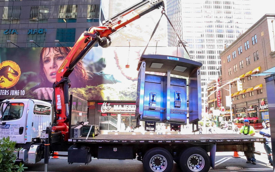 Last street payphone in New York City removed from Manhattan's 7th Avenue by crane on Monday. / Credit: LinkNYC