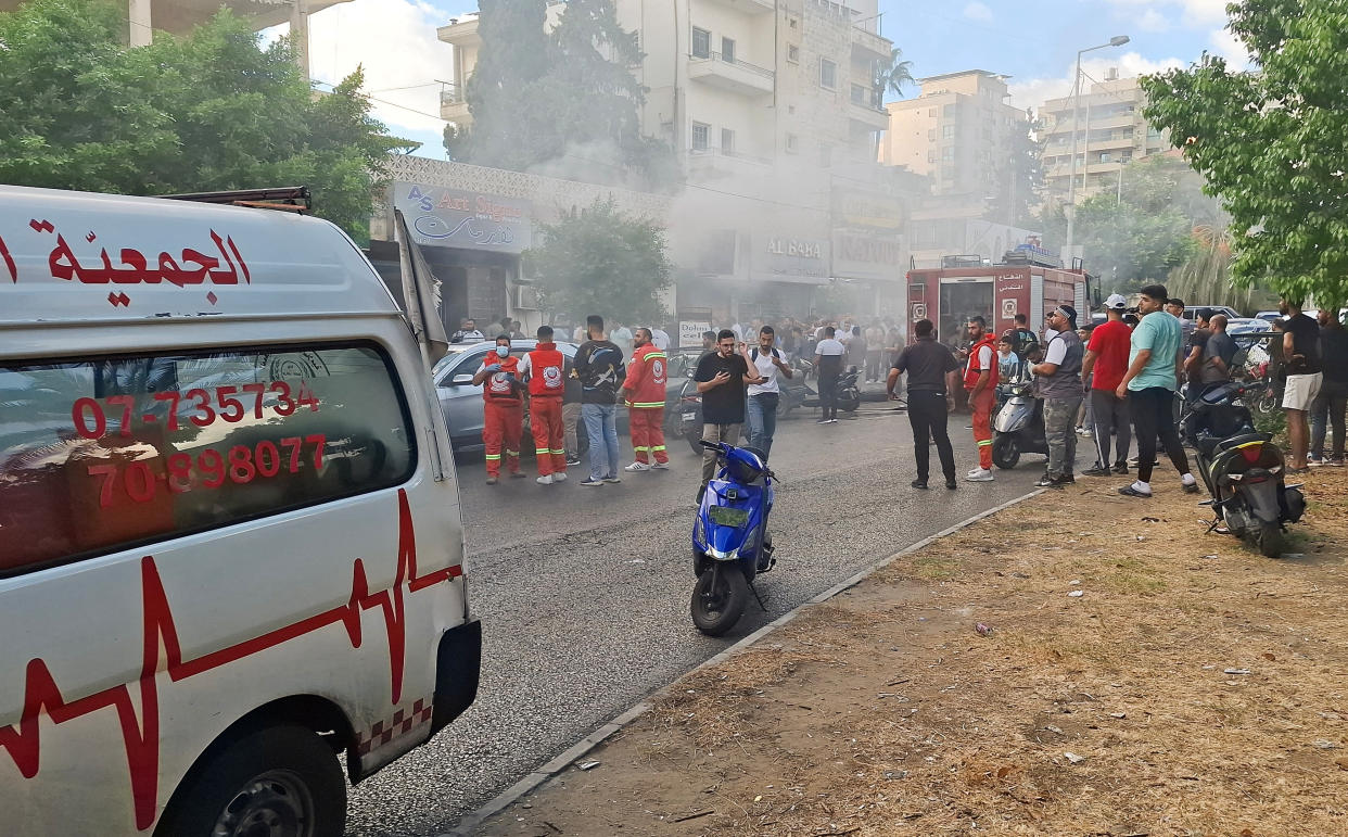 Smoke rises from a mobile shop in Sidon, Lebanon, after walkie-talkies were remotely detonated. (Reuters)