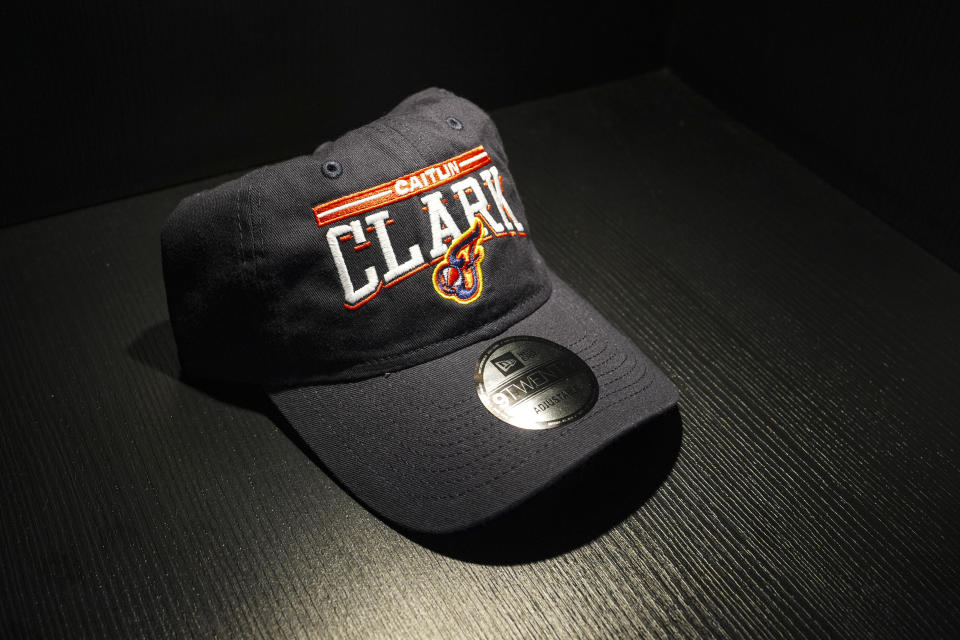 A Caitlin Clark hat is displayed in the Indiana Fever team store in Indianapolis, Tuesday, April 16, 2024. The Fever selected Clark Clark as the No. 1 overall pick in the WNBA basketball draft. (AP Photo/Michael Conroy)