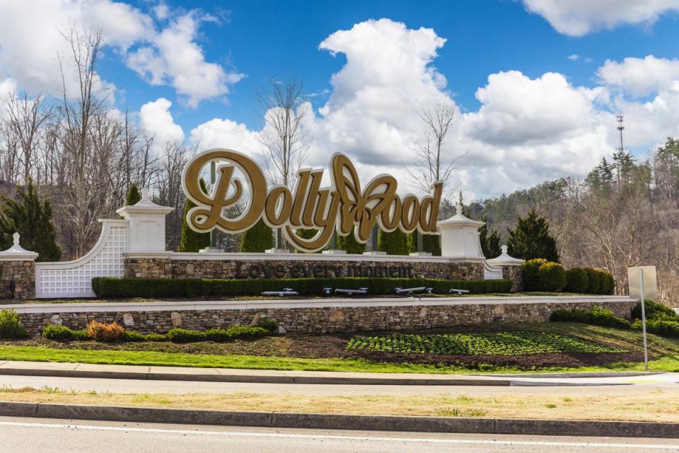 The ‘Dollywood’ sign pictured at the entrance to the theme park. Dolly Parton lent her name to the iconic tourist destination in 1986 (Getty Images)