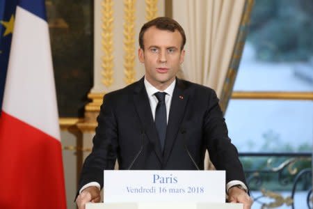 FILE PHOTO: French President Emmanuel Macron gives a joint press conference with Germany's chancellor at the Eylsee presidential Palace in Paris, France March 16, 2018. Ludovic Marin/Pool via REUTERS