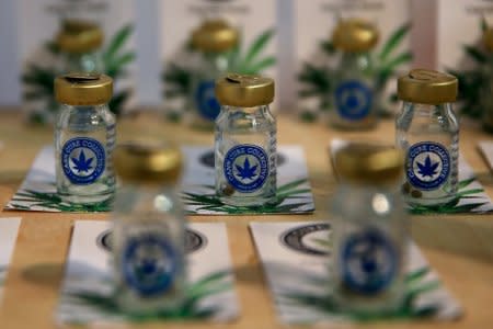 FILE PHOTO: Small bottles containing cannabis seeds are seen at the Balkannabis Expo 2018, in Athens, Greece, June 2, 2018.REUTERS/Costas Baltas