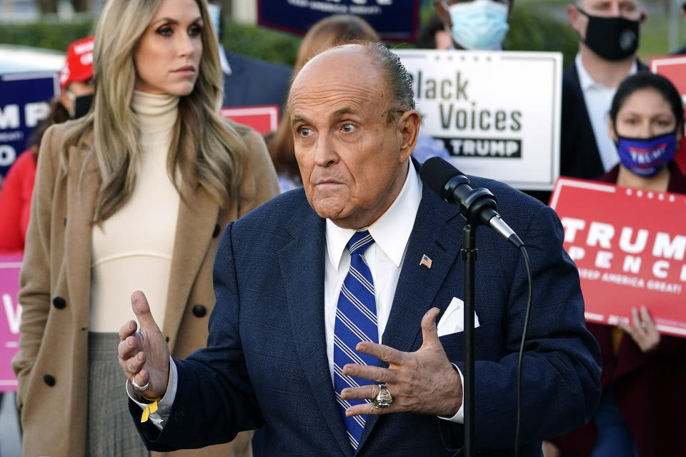 Rudy Giuliani, a lawyer for President Donald Trump, speaks during a news conference on legal challenges to vote counting in Pennsylvania, Wednesday, Nov. 4, 2020, in Philadelphia. At left is Lara Trump, daughter-in-law of President Trump. (AP Photo/Matt Slocum)