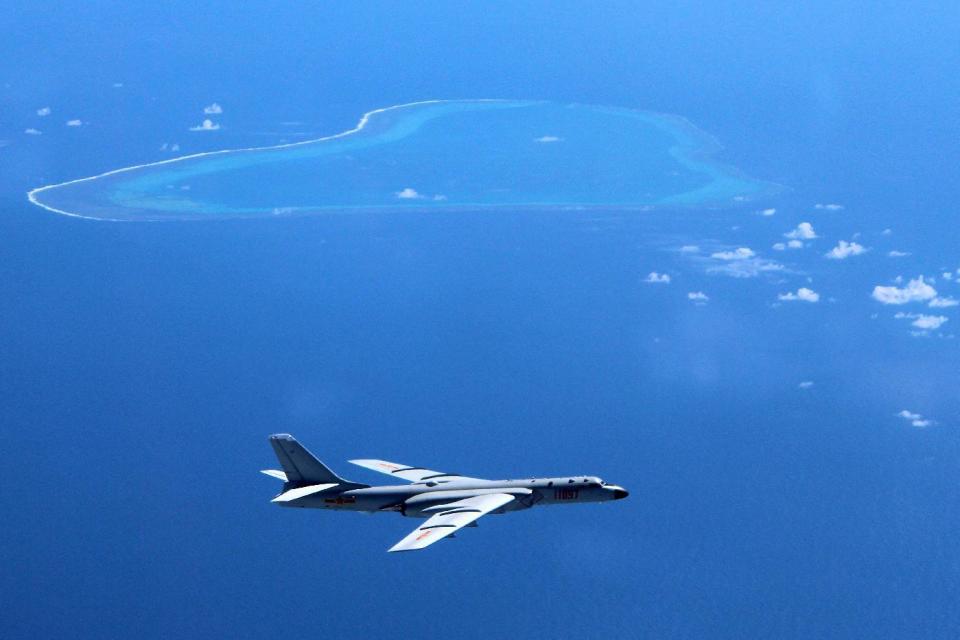 FILE - In this undated file photo released by Xinhua News Agency, a Chinese H-6K bomber patrols the islands and reefs in the South China Sea. A U.S. think tank says recent images appear to show that China has installed anti-aircraft and anti-missile weapons on its man-made islands in the South China Sea. The Center for Strategic and International Studies said in a report this week that the anti-aircraft guns and a close-in weapons systems designed to guard against missile attack have been placed on all seven of the islands that China has created by piling sand on top of coral reefs. (Liu Rui/Xinhua via AP, File)