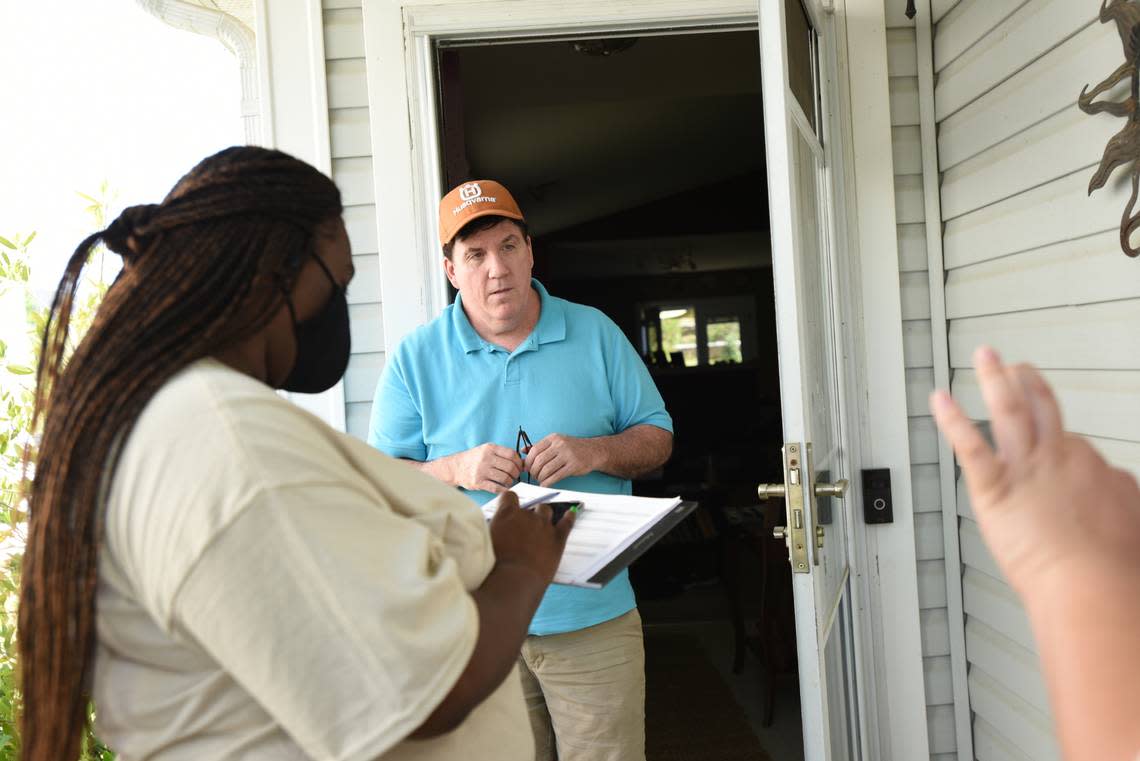 Home owner Thomas McGrath speaks with Jessica Moreno, right, Housing Justice Organizer, Action NC, and volunteer Pattache Roper, left, during the canvasing of a neighborhood in Charlotte on Saturday April 23, 2022. Action NC is working to add tenants of corporate landlords to a national tenants union.