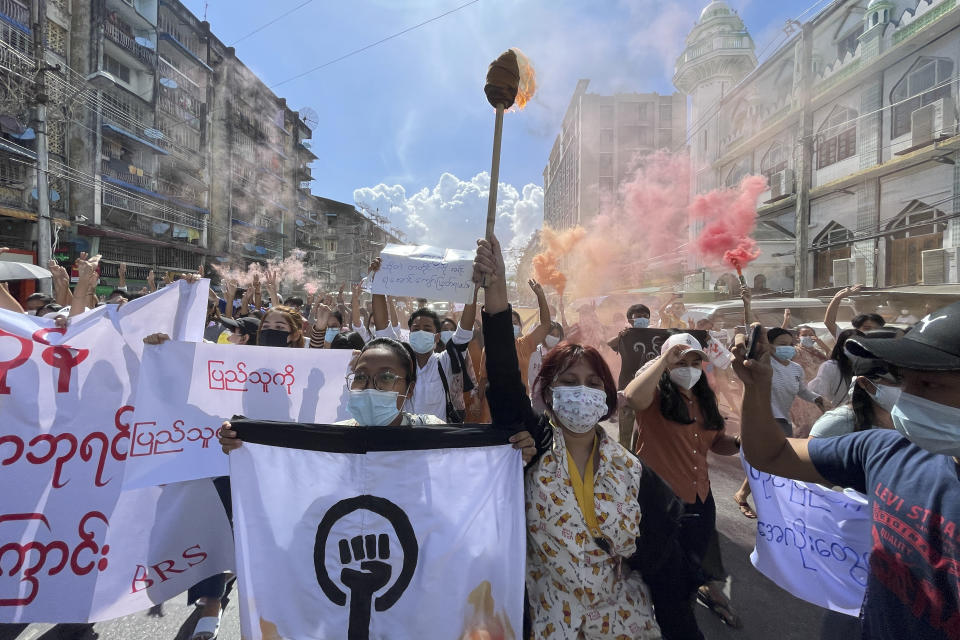 Protesters march holding slogans during a protest at Pazundaung township in Yangon, Myanmar, Wednesday July 14, 2021. (AP Photo)