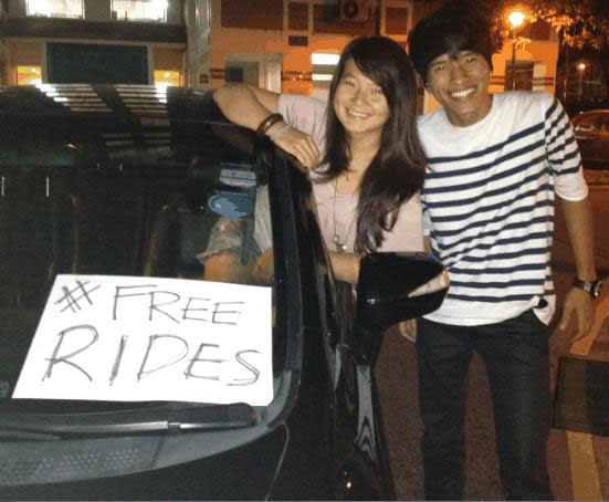 Isaac Ong and Ruby Tan, both 23, went out to give free rides after taxi fare hikes were announced. (Photo courtesy of Deborah Choo)