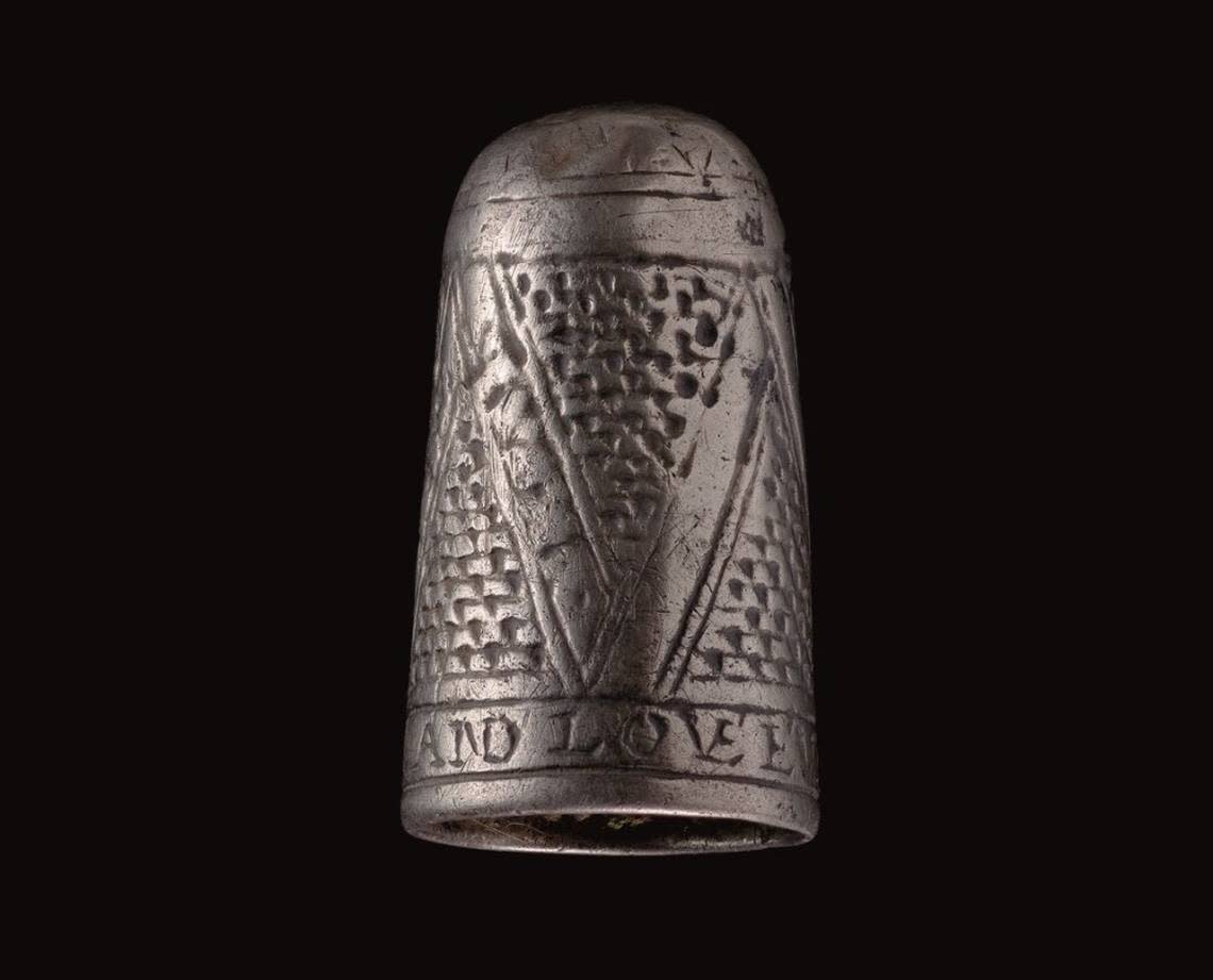 The ancient silver thimble has a Roman engraving at the bottom of its body, experts said. Photo from Museum Wales