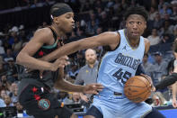 Washington Wizards guard Bilal Coulibaly defends against Memphis Grizzlies forward GG Jackson II (45) during the first half of an NBA basketball game Tuesday, March 12, 2024, in Memphis, Tenn. (AP Photo/Nikki Boertman)