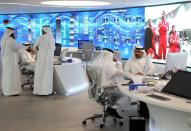 Staff are seen at the Panorama Digital Command Centre at the ADNOC headquarters in Abu Dhabi