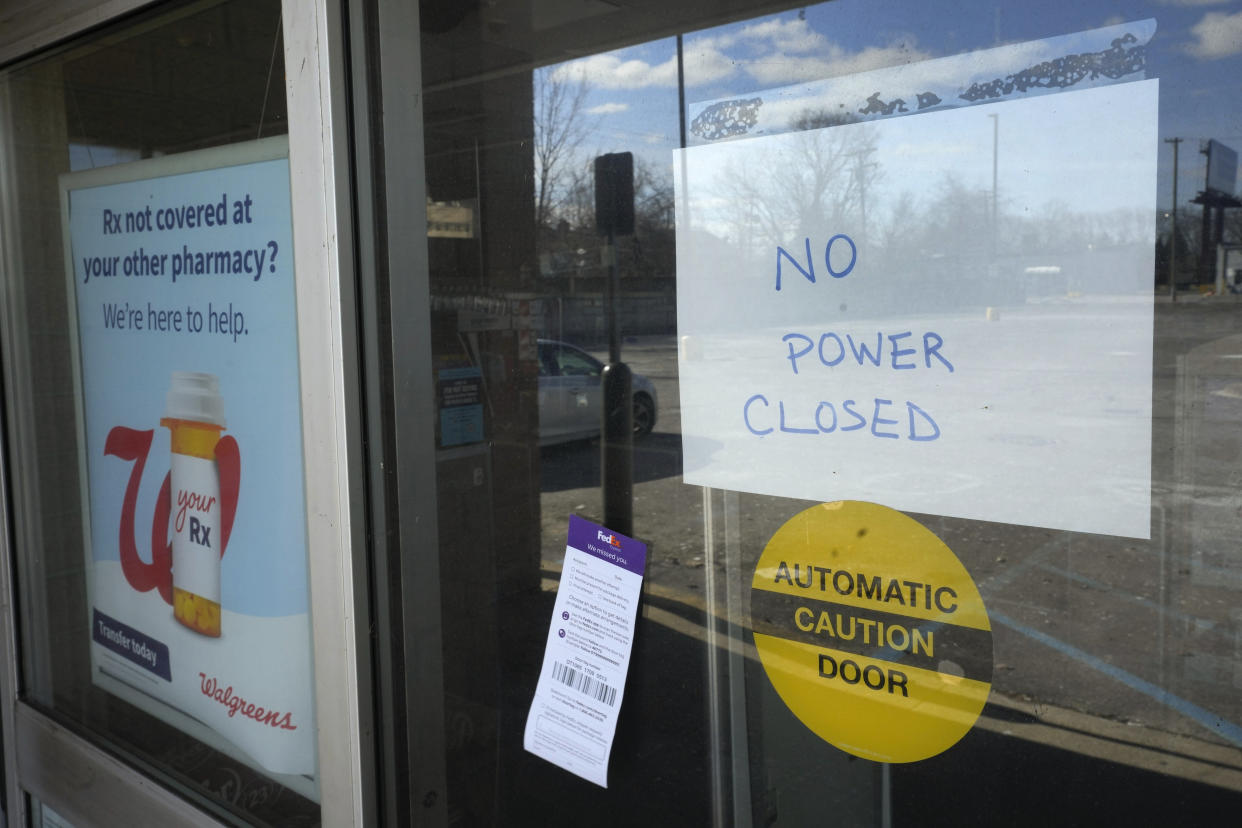 A no power closed sign is displayed at a Walgreens store in Detroit, Friday, Feb. 24, 2023. Michigan is shivering through extended power outages caused by one of the worst ice storms in decades. (AP Photo/Paul Sancya)