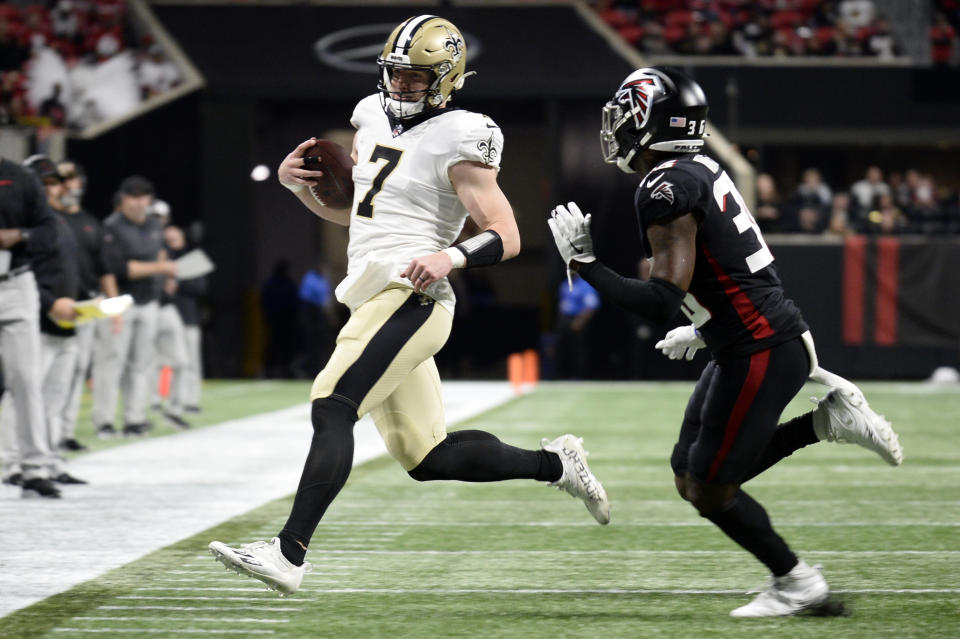 Taysom Hill left Sunday's game with a foot injury. (Photo by Edward M. Pio Roda/Getty Images)