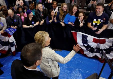 Democratic U.S. presidential candidate Hillary Clinton leaves the stage to greet supporters after speaking at a primary night party in Columbia, South Carolina, February 27, 2016. REUTERS/Jonathan Ernst