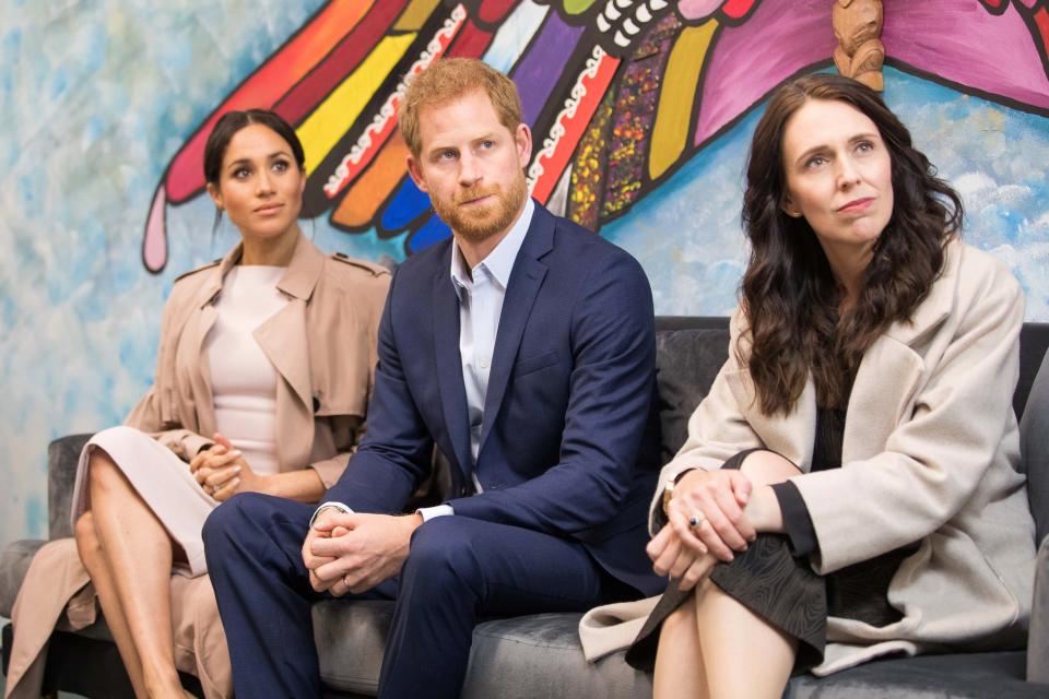 Britain's Prince Harry and his wife Meghan, the Duchess of Sussex join New Zealand's Prime Minister Jacinda Ardern (R) on a visit to Pillars, a charity operating across New Zealand that supports children who have a parent in prison by providing special mentoring schemes, in Manukau City in Auckland on October 30, 2018. - Meghan Markle displayed an unexpected talent for "welly wanging" in Auckland on October 30, gaining bragging rights over husband Prince Harry after they competed in the oddball New Zealand sport. (Photo by JASON DORDAY / POOL / AFP)        (Photo credit should read JASON DORDAY/AFP via Getty Images)