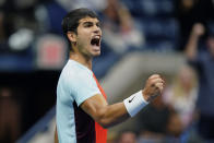 Carlos Alcaraz, of Spain, lets out a yell as he plays against Jannik Sinner, of Italy, during the quarterfinals of the U.S. Open tennis championships, Thursday, Sept. 8, 2022, in New York. (AP Photo/Frank Franklin II)