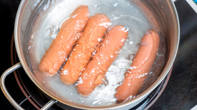 Aerial shot of hot dogs in water